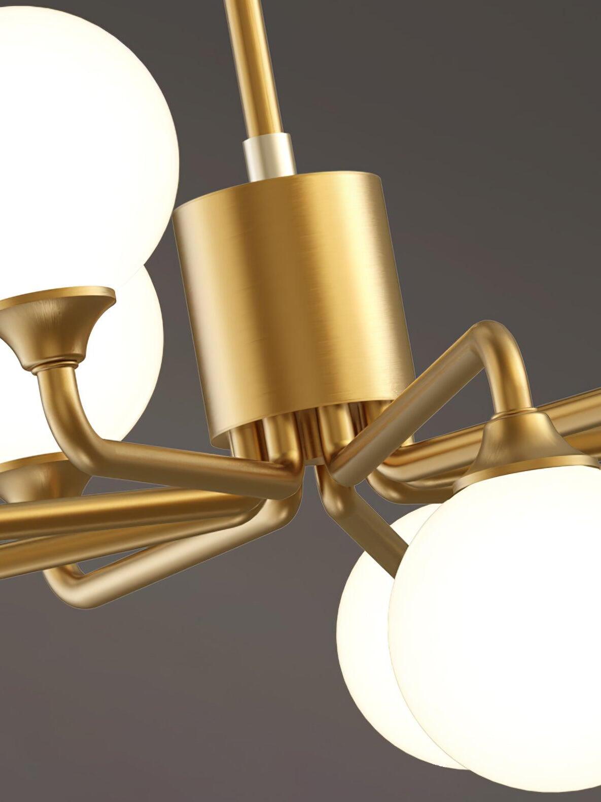 Brass arm and central fitting close beside glass globes