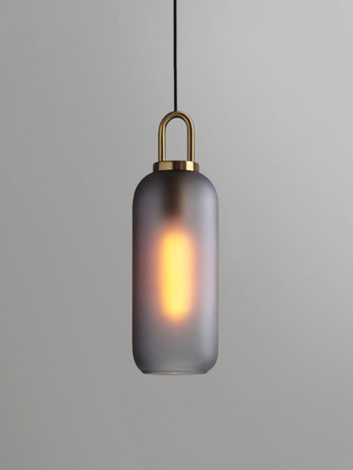 Smoky frosted capsule shade with a glowing elongated bulb