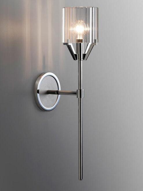 Chrome tall-stem sconce against a dark wall