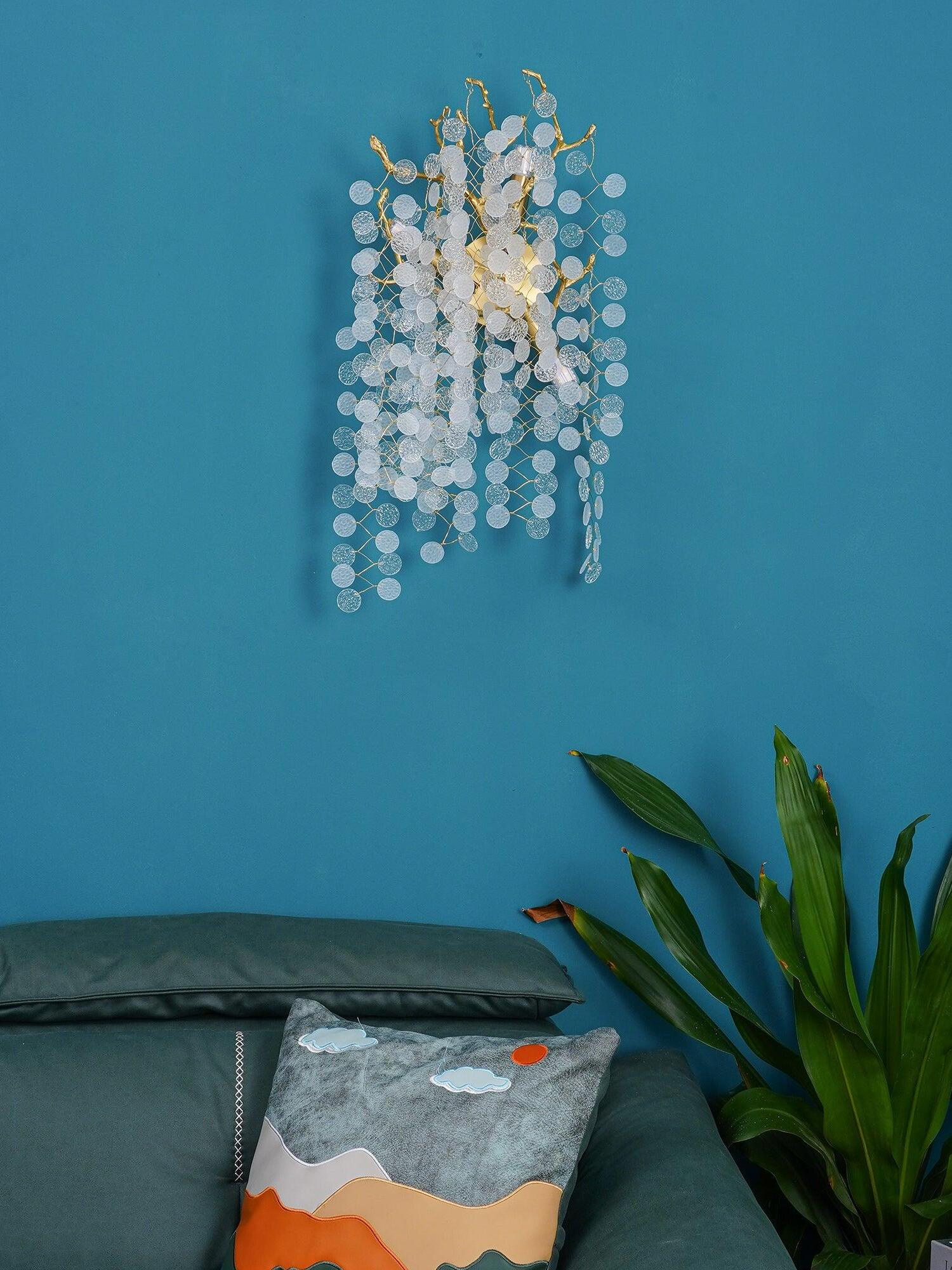 Branched disc wall lamp on a blue wall