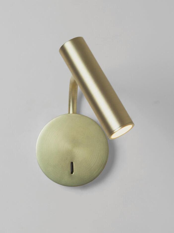 Gold-coloured tilted reading head and round plate