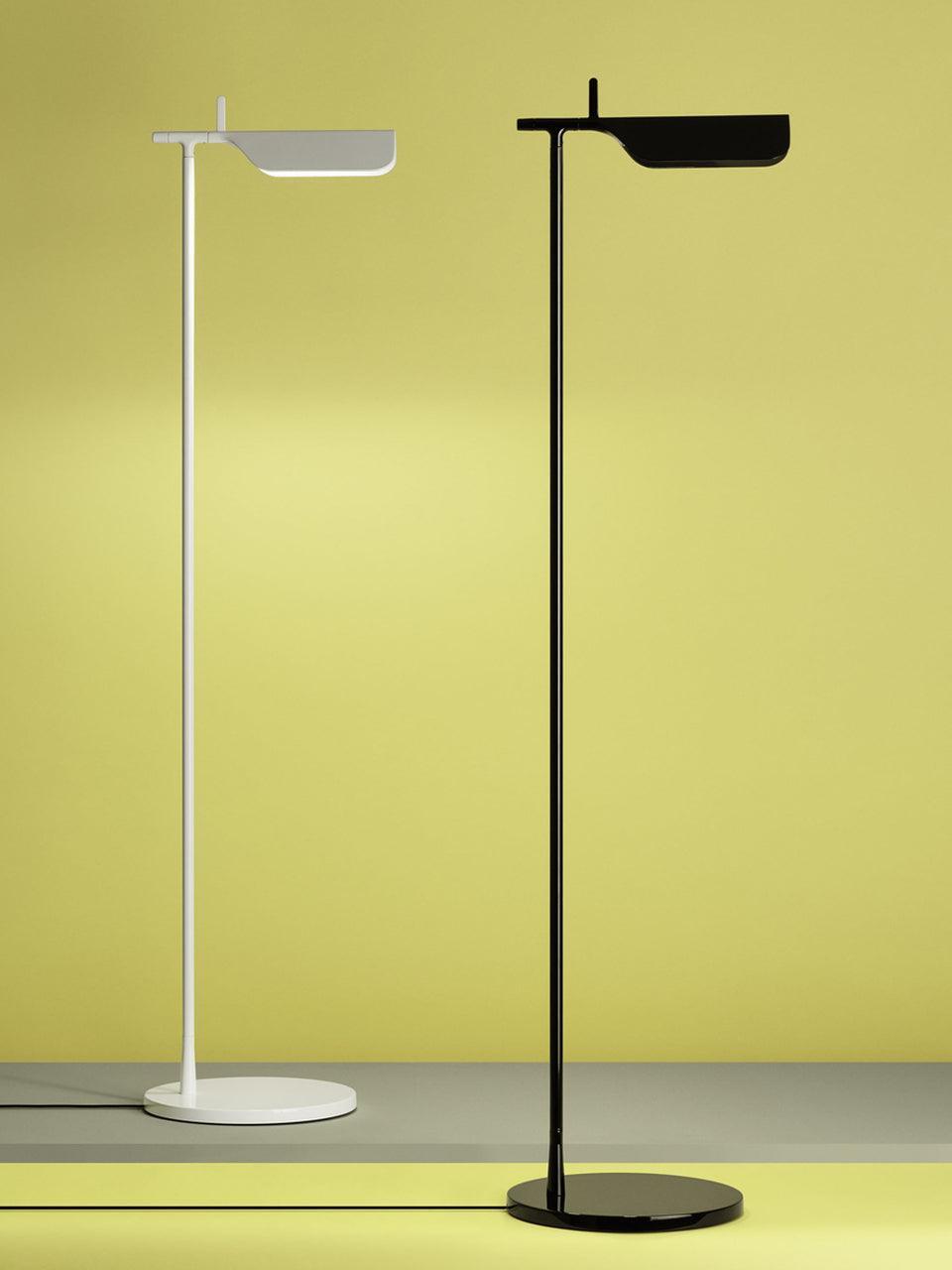White and black floor lamps displayed side by side