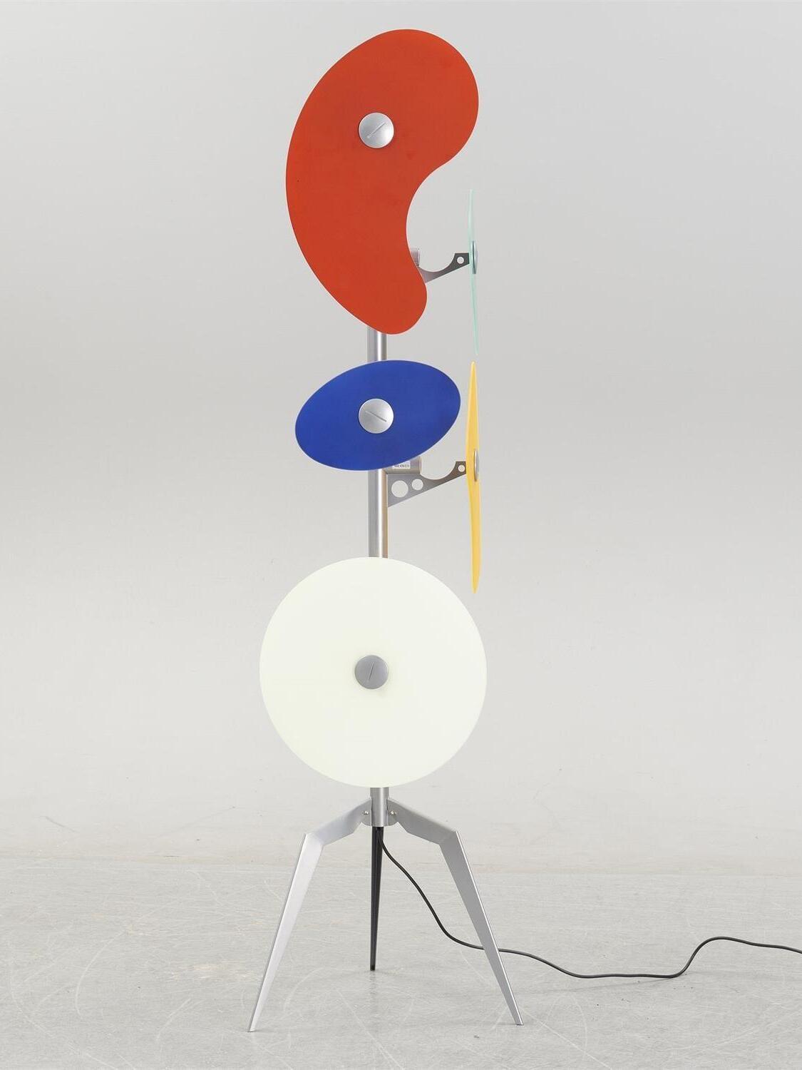 Side view of multicolour floor lamp with cord
