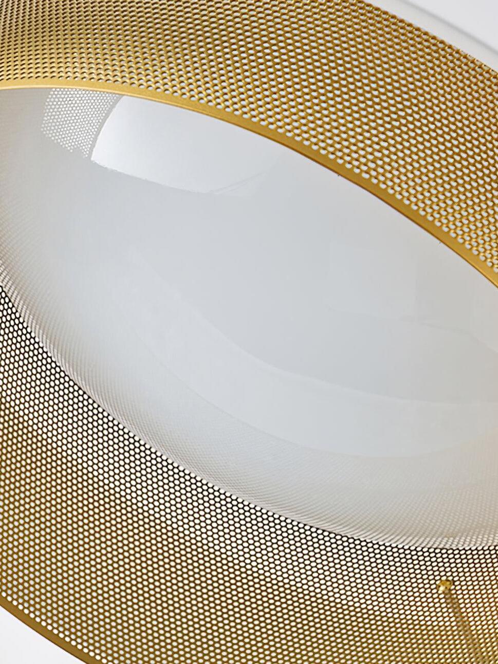 Underside close-up of the white Nolan diffuser encircled by a perforated gold-finish ring
