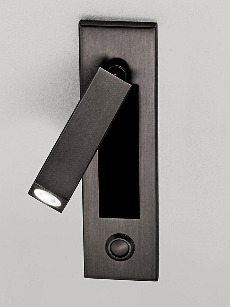 Matt black squared reading head with a round button below the wall recess
