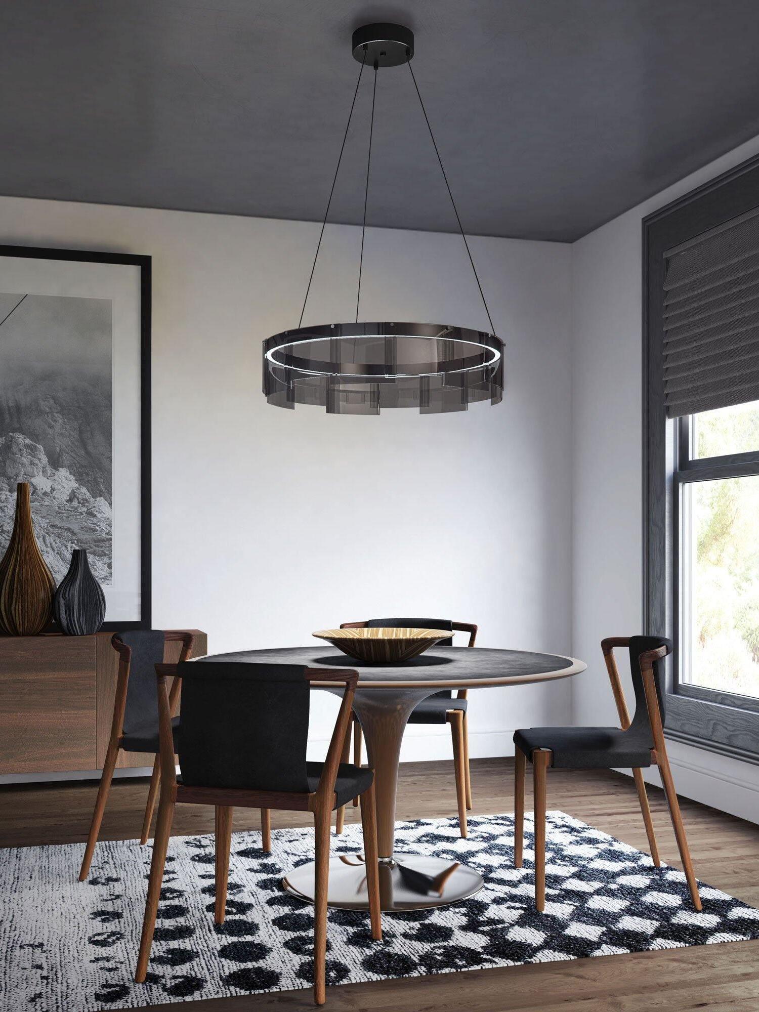Glass ring chandelier over a dark dining table
