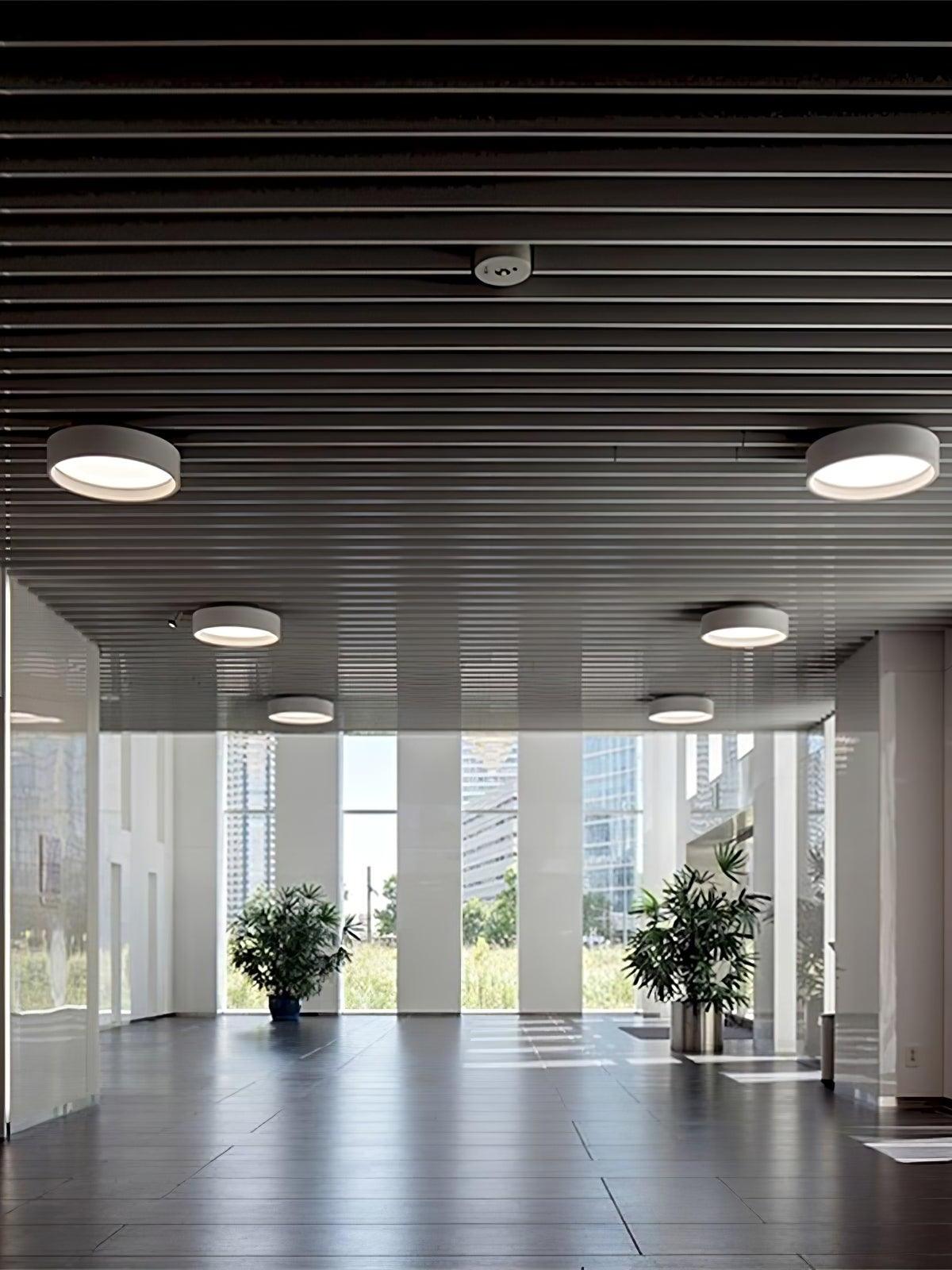 Multiple round lights in slatted ceiling interior