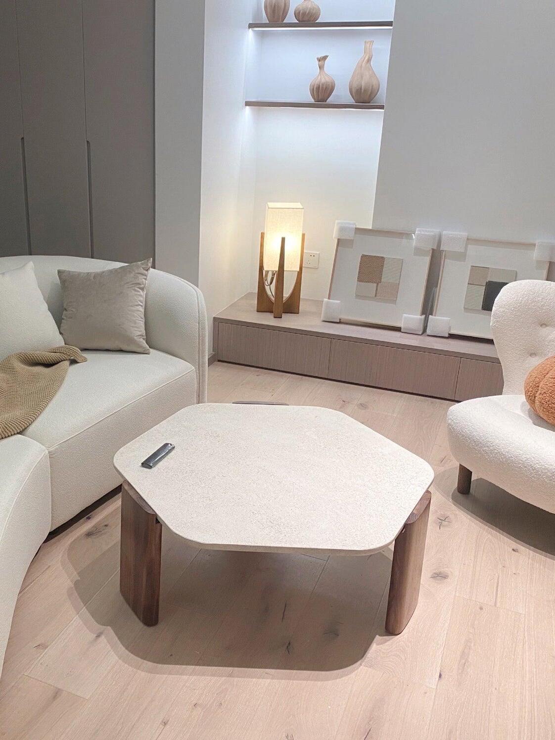 Wood frame lamp in a pale living room