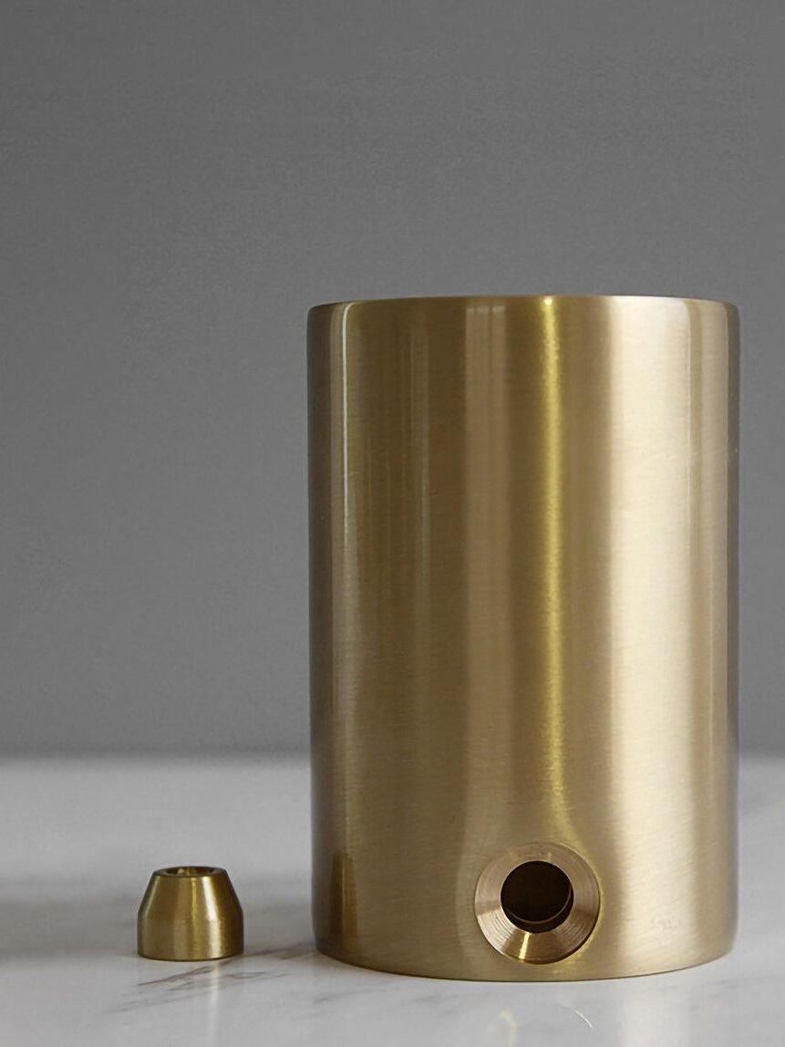 Empty gold-tone lamp cylinder with cable opening and loose fitting