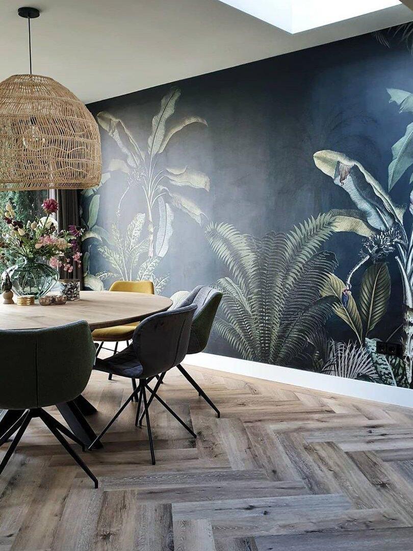 Natural wicker pendant beside a patterned wall