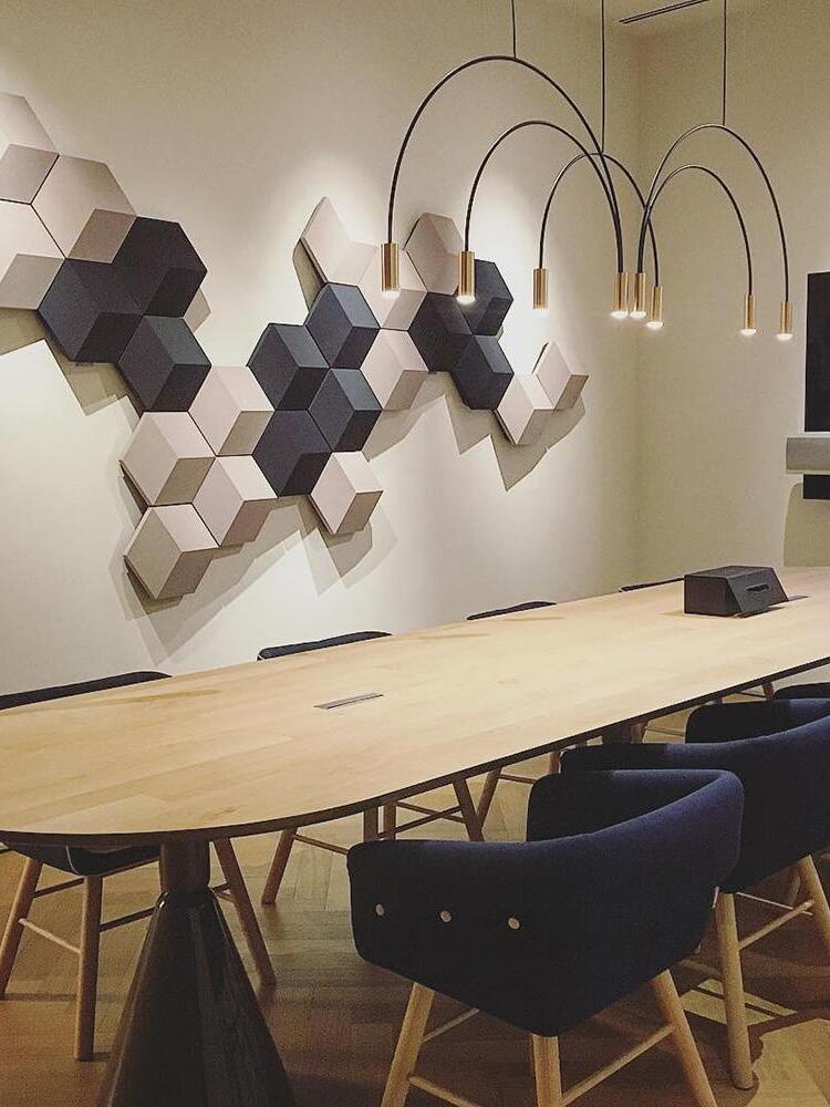 Gold-head arch pendant above a wooden table
