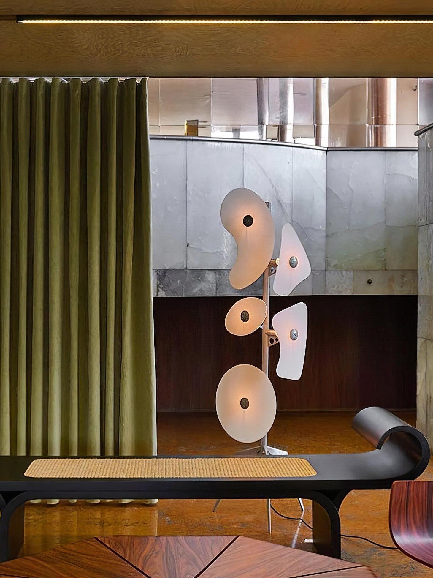 White panel floor lamp near a window bench