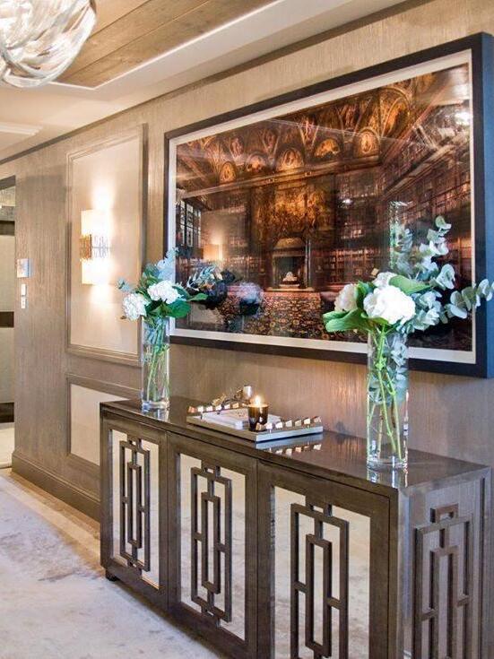 Silver chain ceiling light above console in room