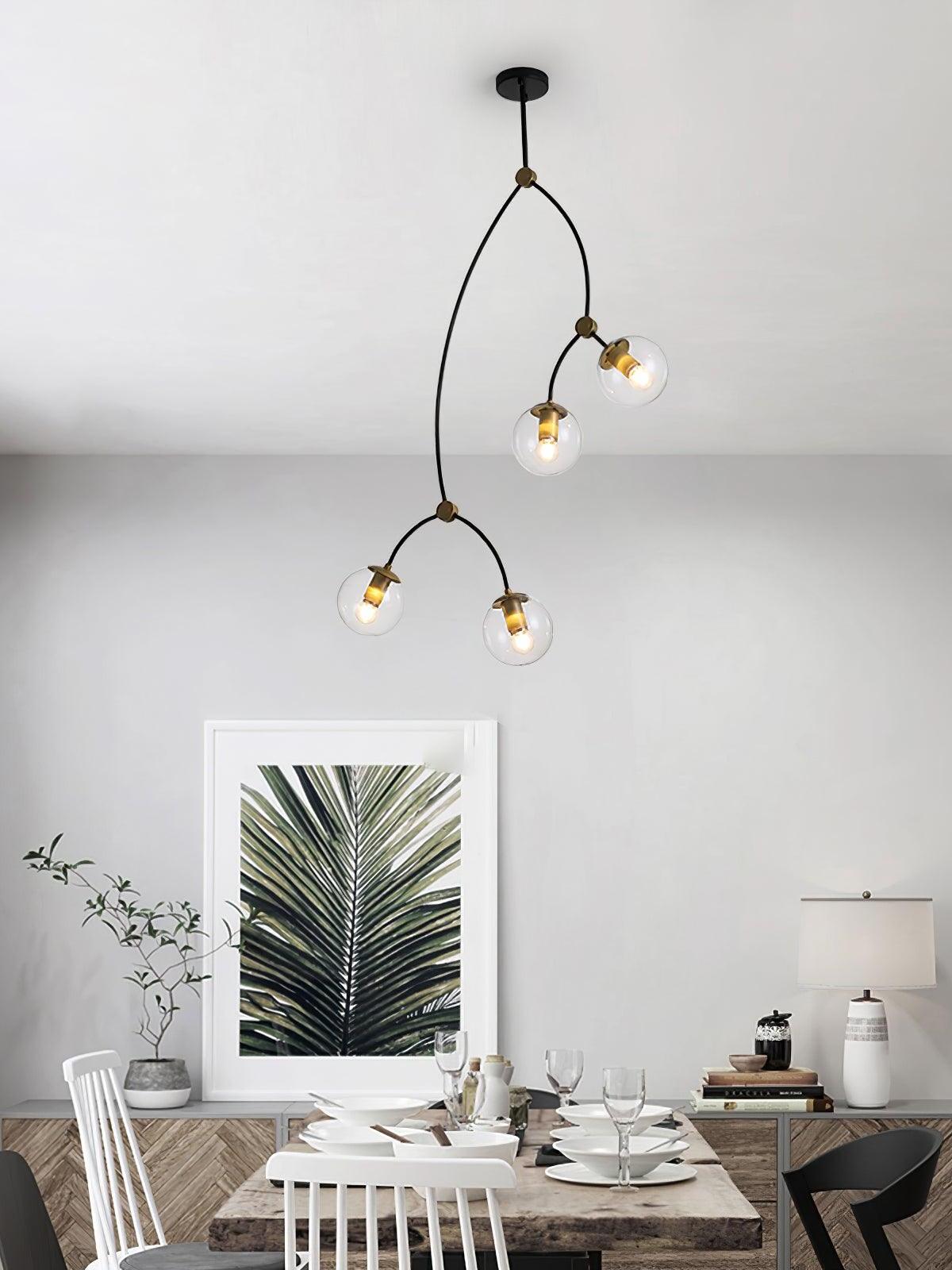 Four clear glass globes on a tall branching frame