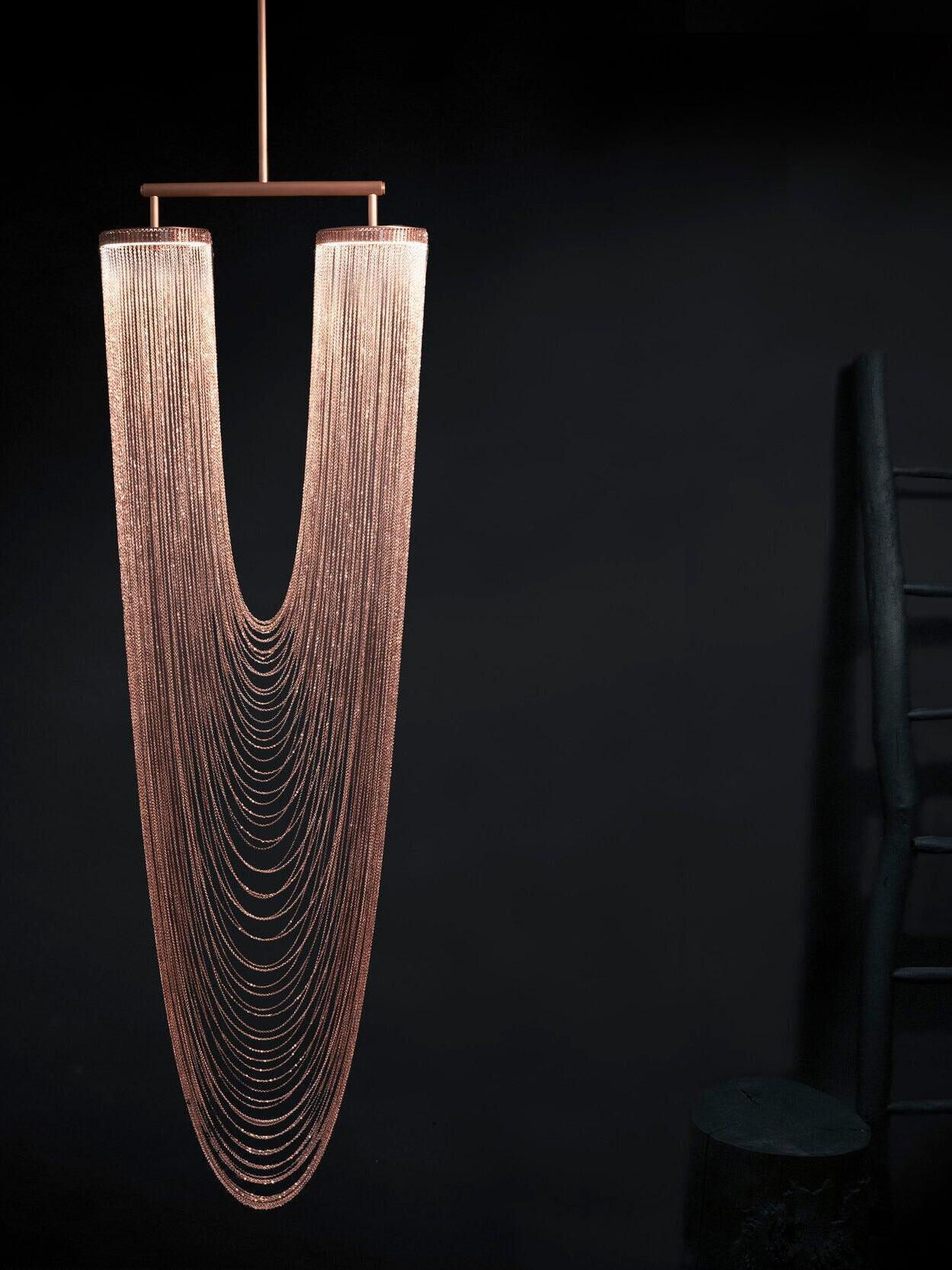 Long draped chains below two upper rings