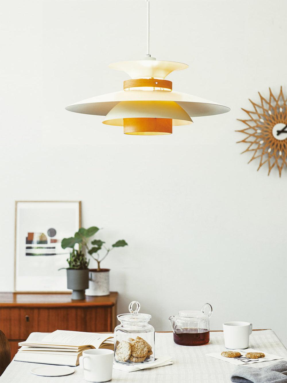 Illuminated pendant in a white dining arrangement