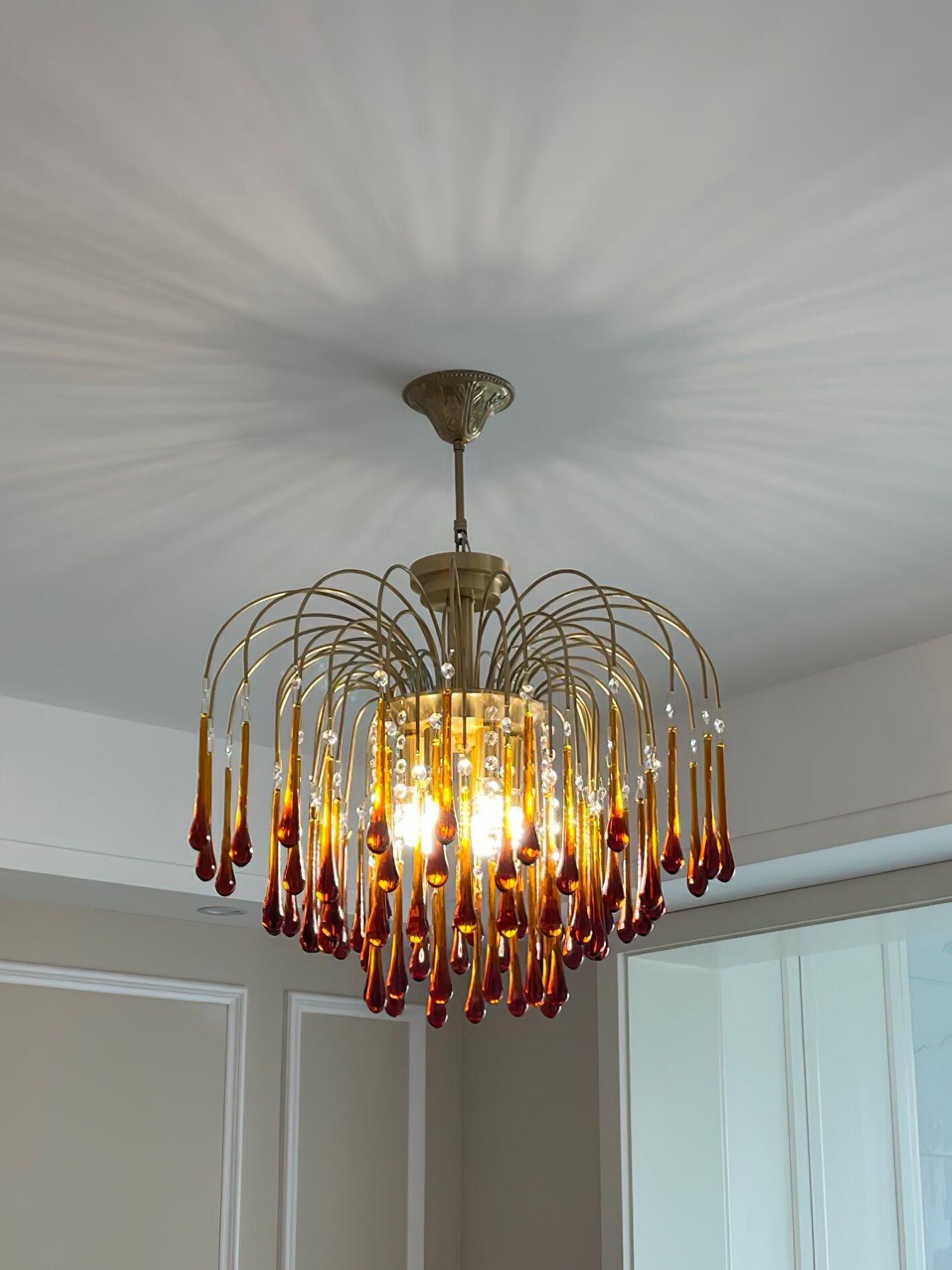 Illuminated crystal chandelier in a bright interior