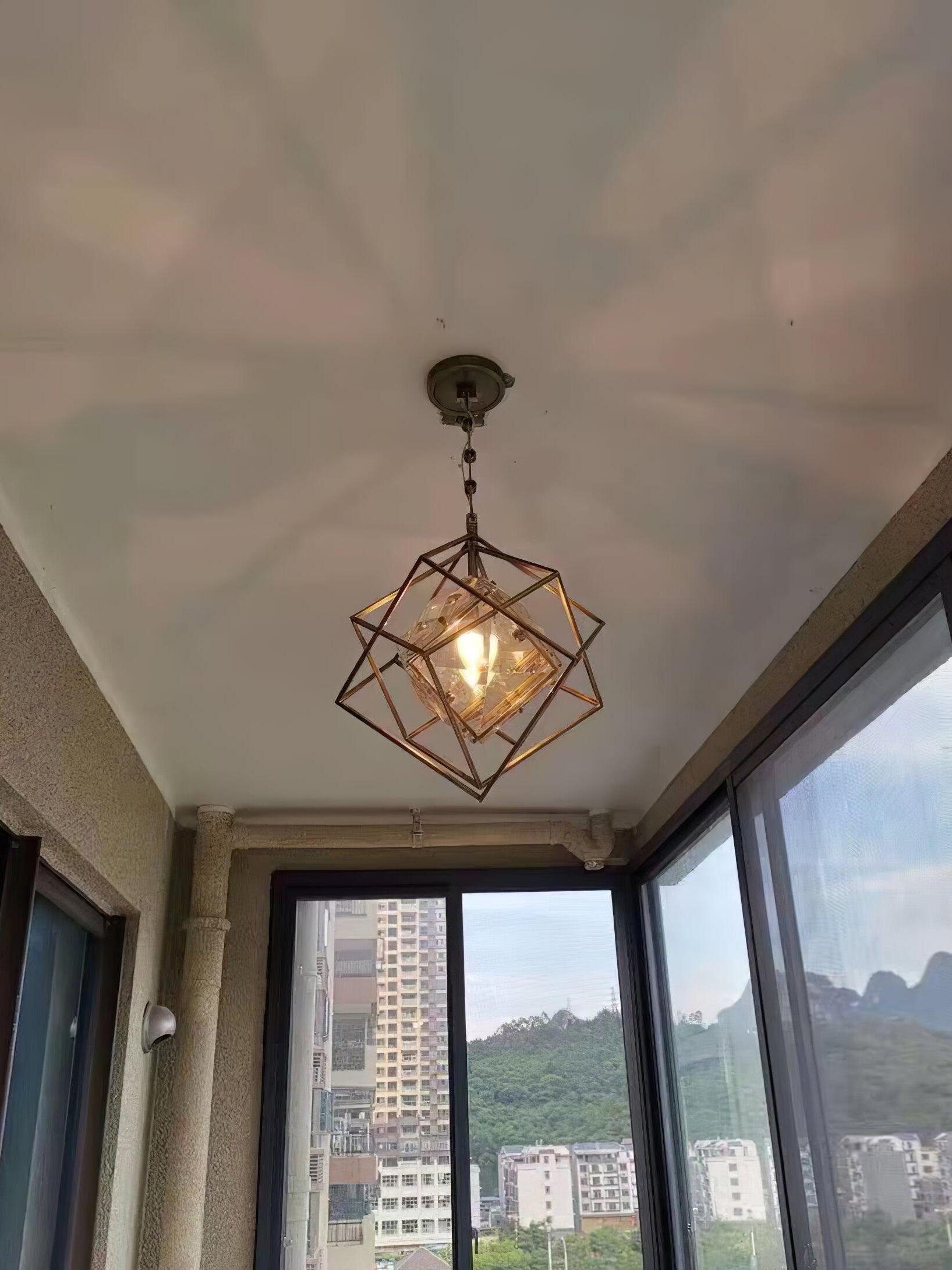 Glowing Epic pendant near tall windows overlooking trees and buildings