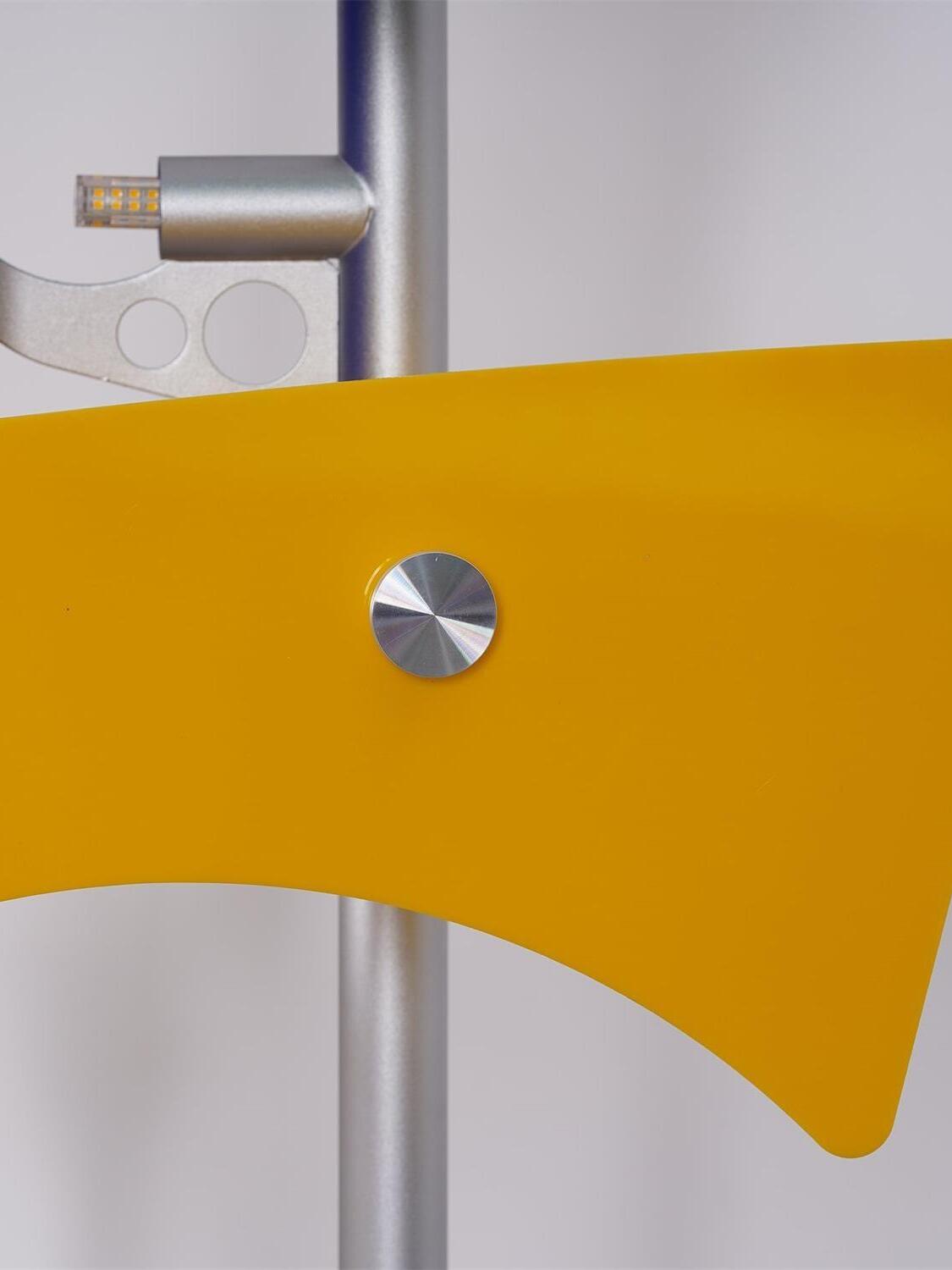 Yellow panel with central fastener and light source detail