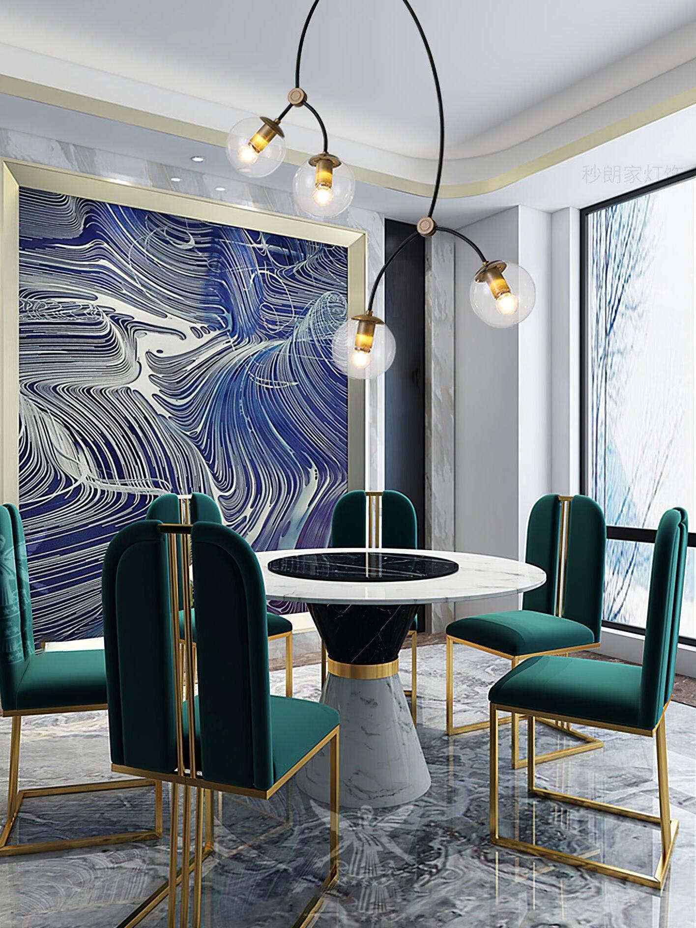 Tall clear globe chandelier above a small dining table