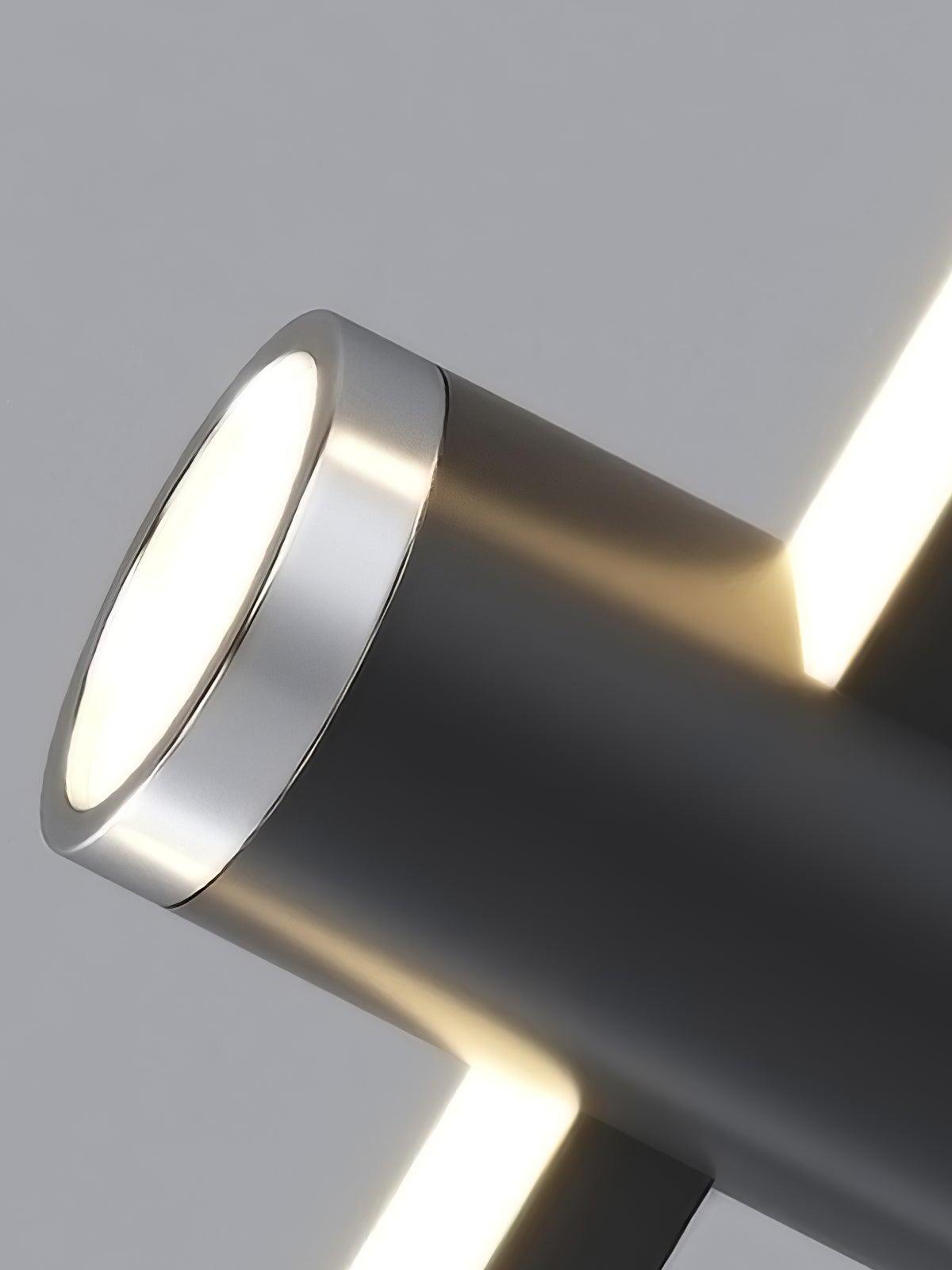 Illuminated cylinder end beside a linear LED bar