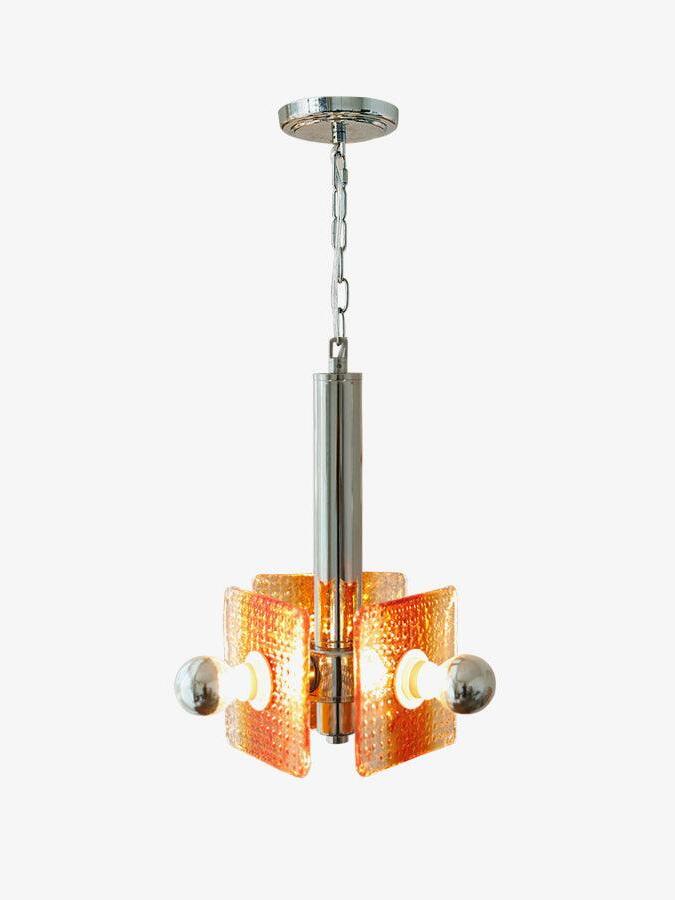 Alohi chrome and orange glass pendant shown with chain and circular canopy