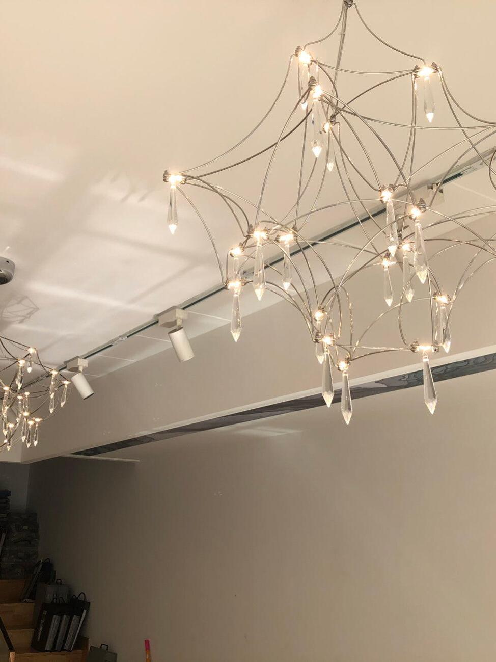 Fine frame chandelier viewed near a ceiling