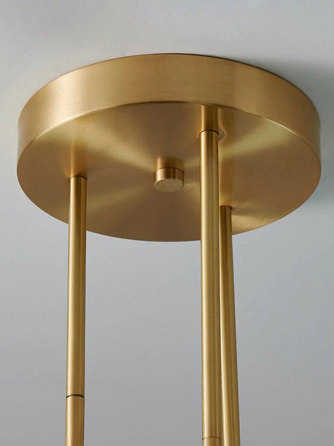 Close-up of the round brass-tone Arteriors ceiling canopy and three descending rods