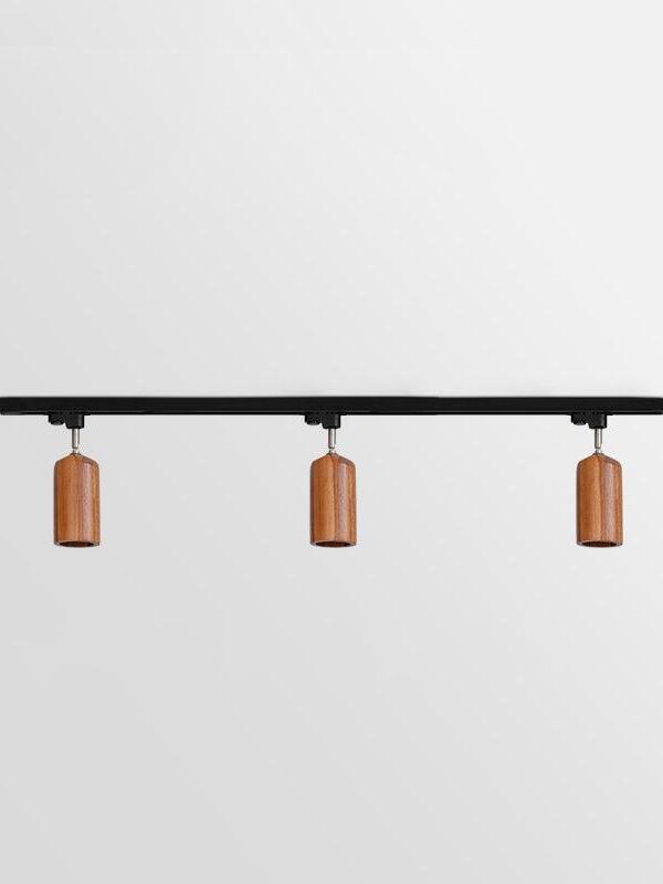 Three dark cylindrical wood spots on longer bar