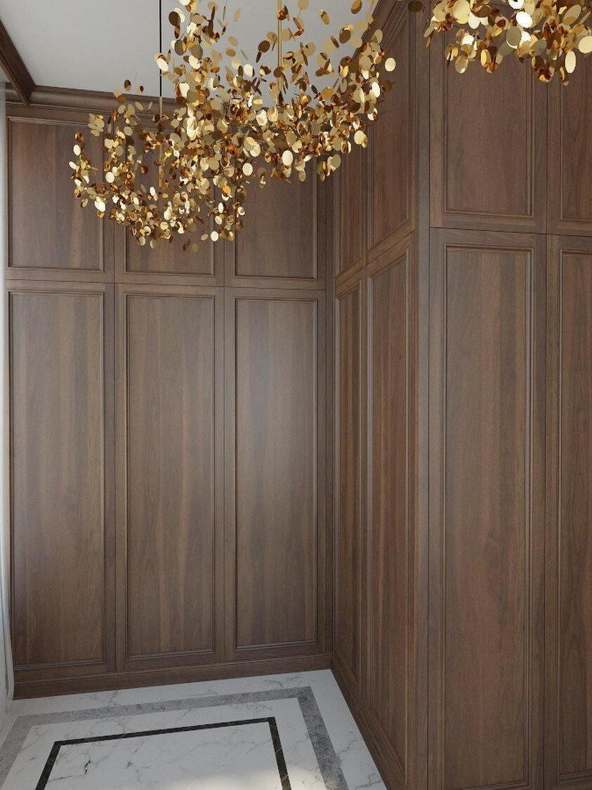 Warm metal-disc cluster beside tall timber wall panels