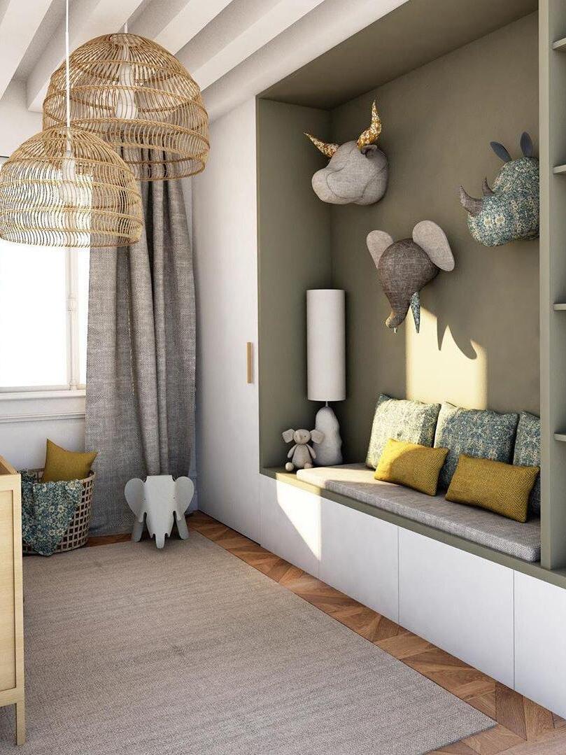 Natural woven pendants above built-in seating beside animal wall decorations