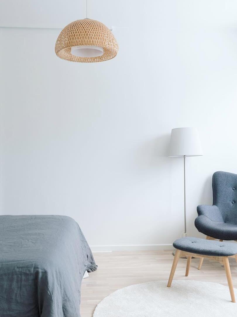 Natural bamboo dome pendant in a light bedroom