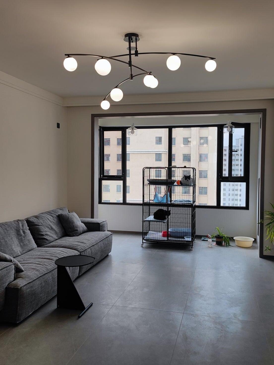 Black globe chandelier in a bright living room