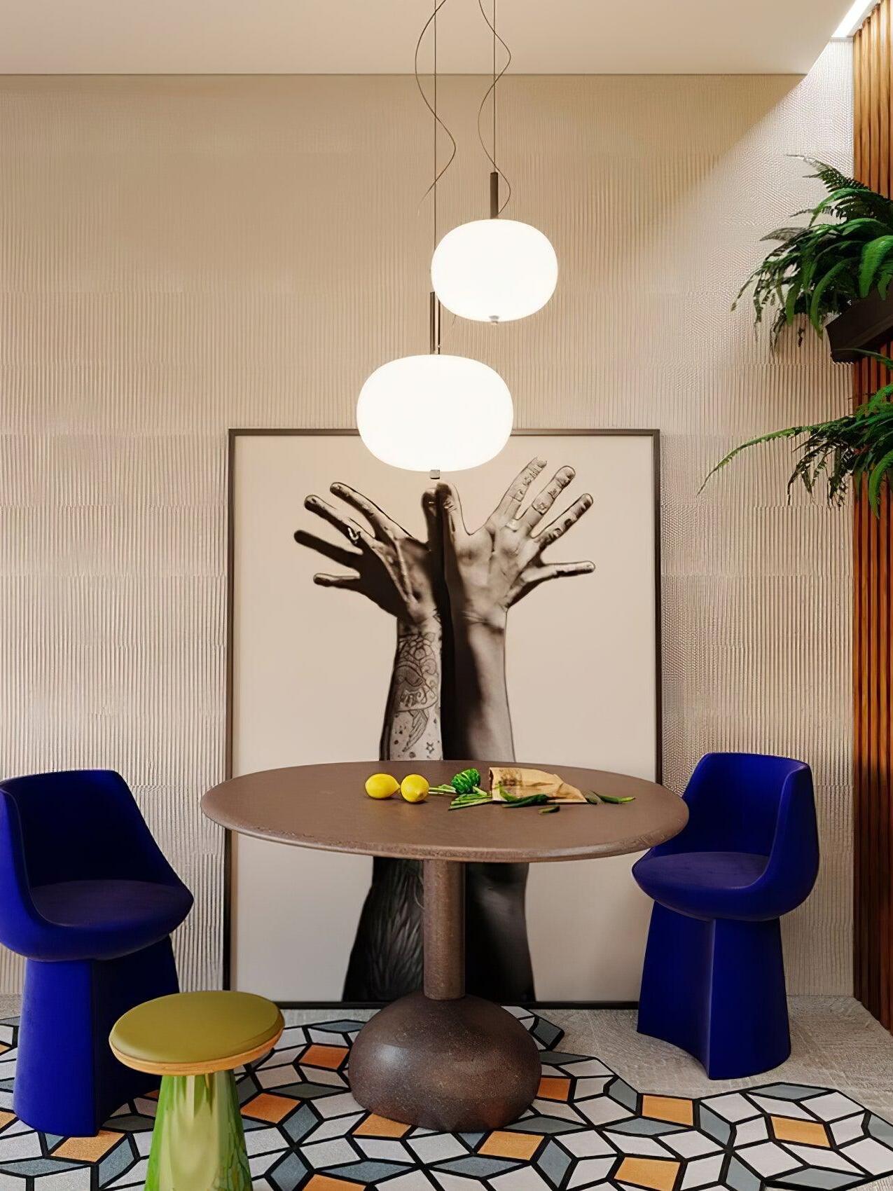 Two-globe pendant above a round dining table