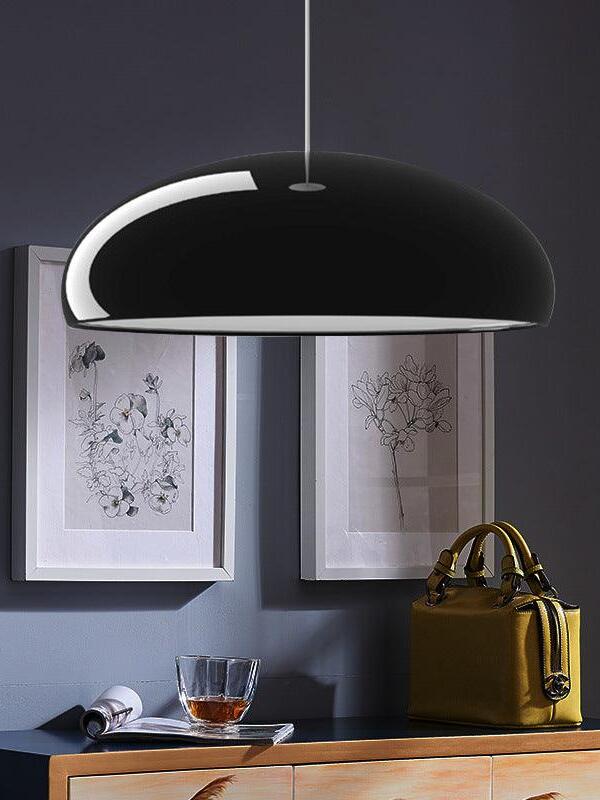 Black shallow dome above a console and artwork