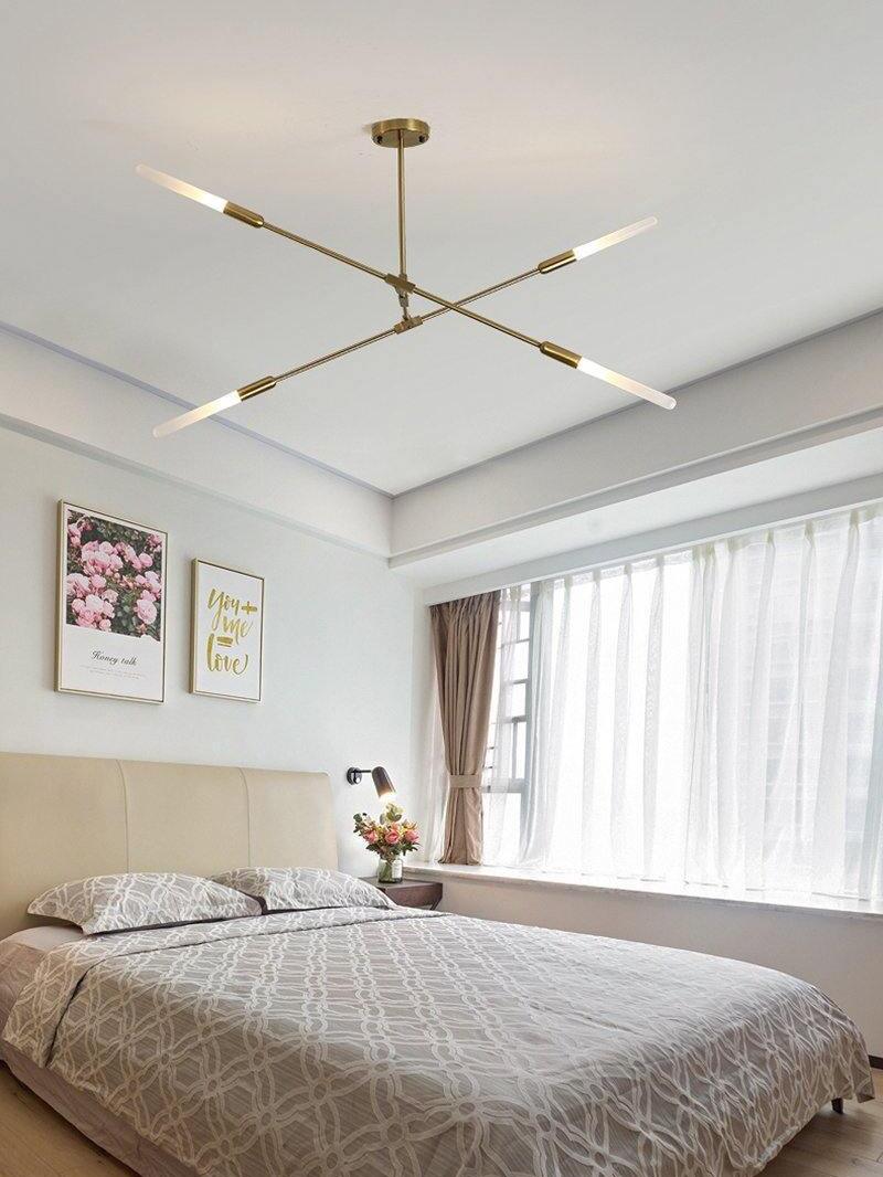Gold chandelier with pale tips in a bedroom