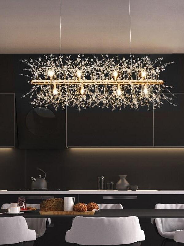 Linear glass chandelier in a dark dining room