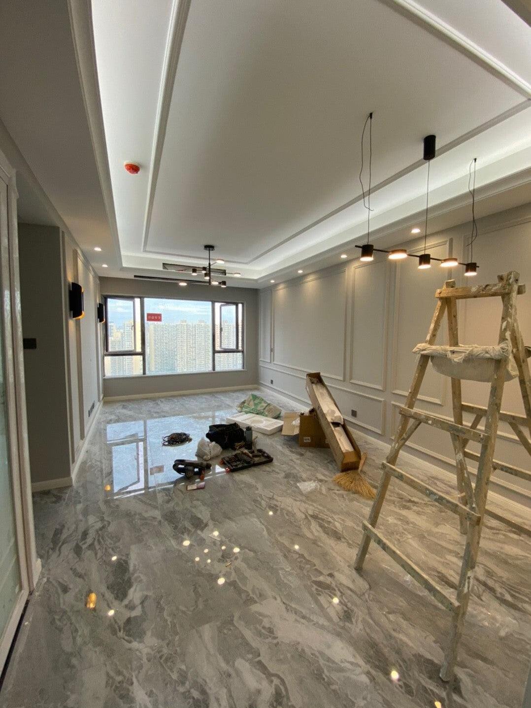 Long linear fixture in a room undergoing interior work