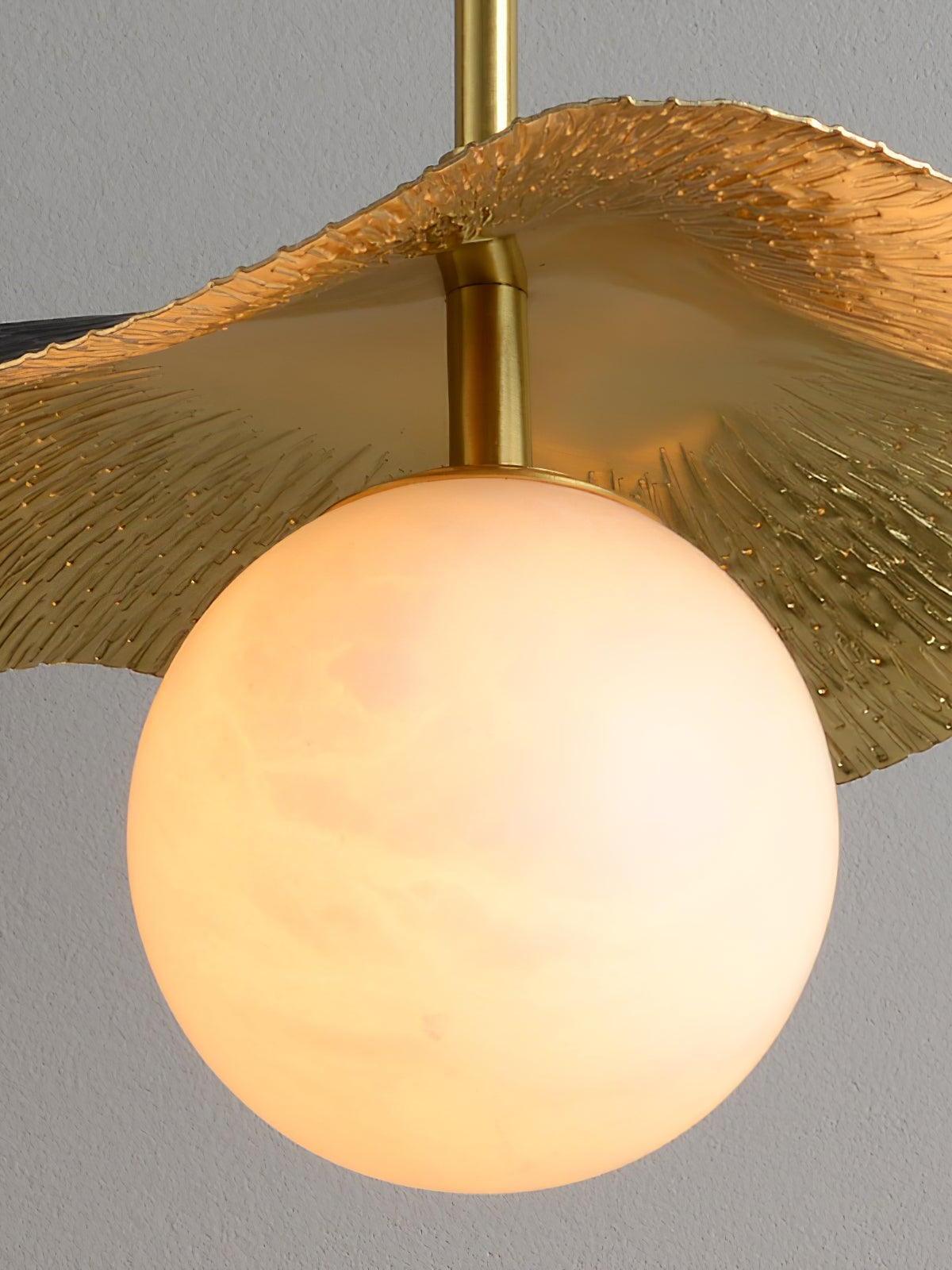 Close view of pale clouded globe and brass-toned underside