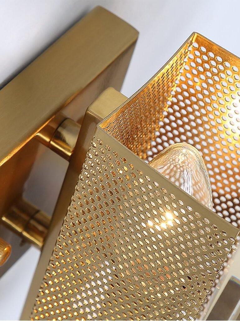 Perforated metal bulb guard behind the glass panel