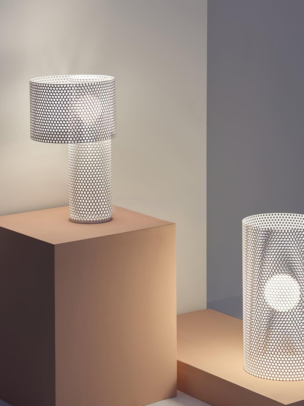 Embrey drum table lamp beside a separate cylindrical lamp