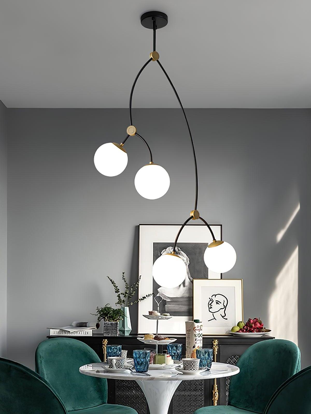 White four-globe chandelier in a dining nook