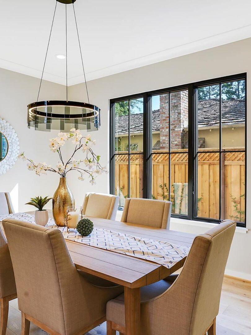 Glass ring chandelier above a dining setting