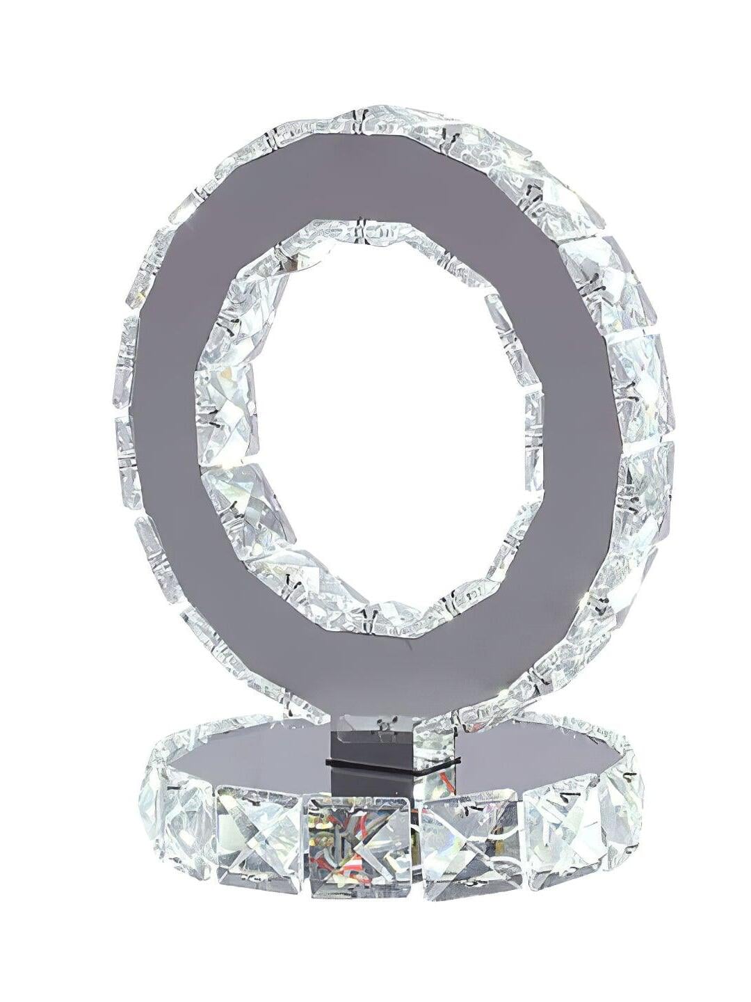 Unlit Crystal Rings lamp with a mirrored ring face and faceted base on a white background