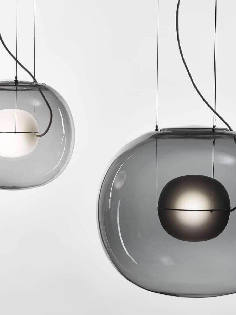 Smoked glass globe pendants with white and dark inner spheres