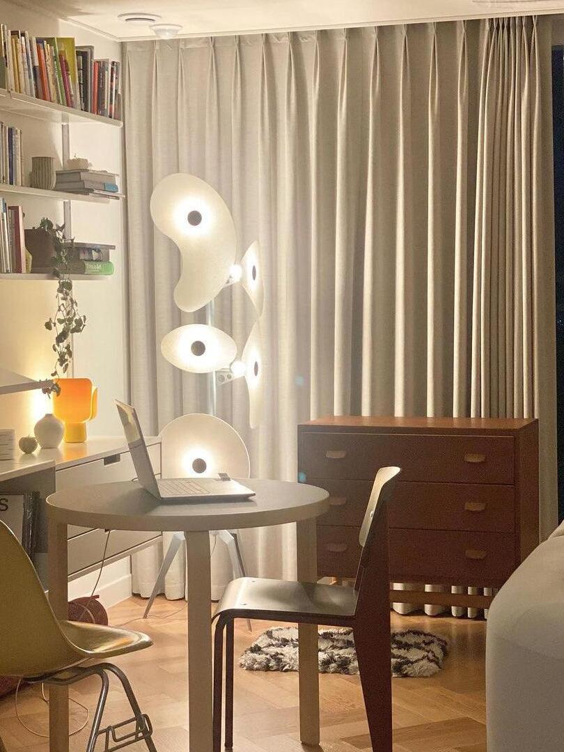 White panel lamp beside a dining table