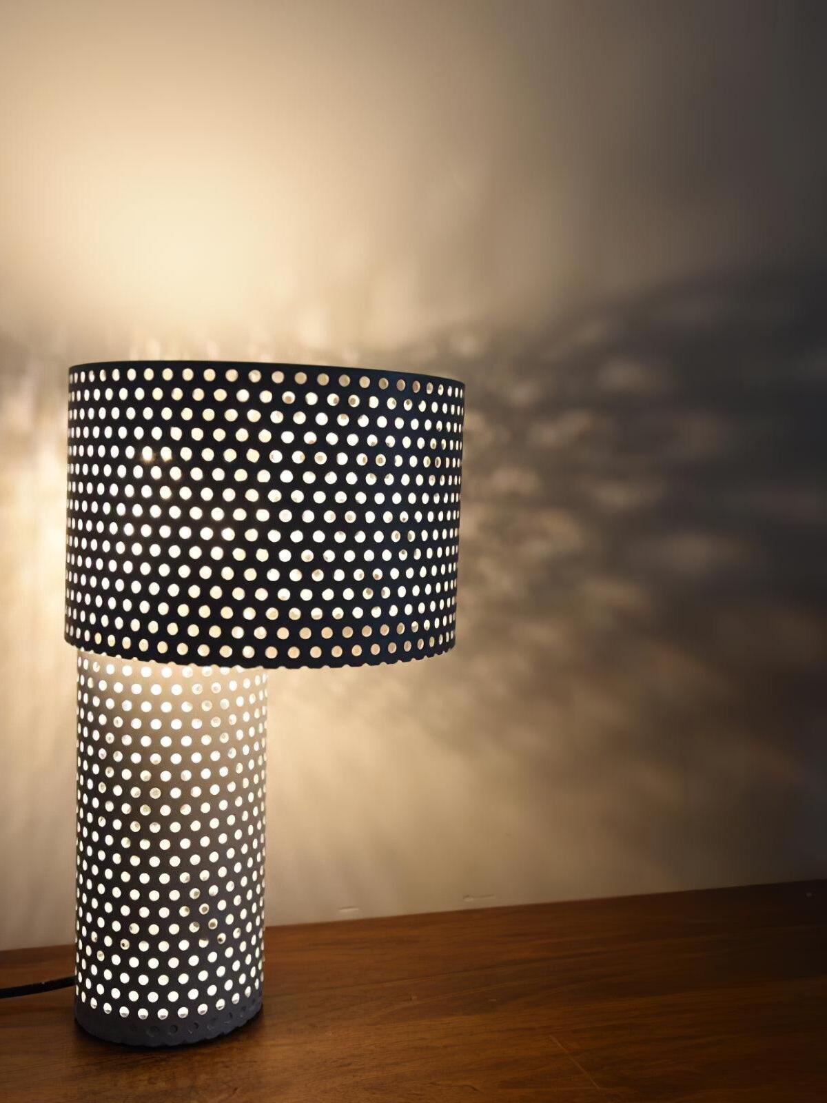 Close view of perforated shade and dotted shadows