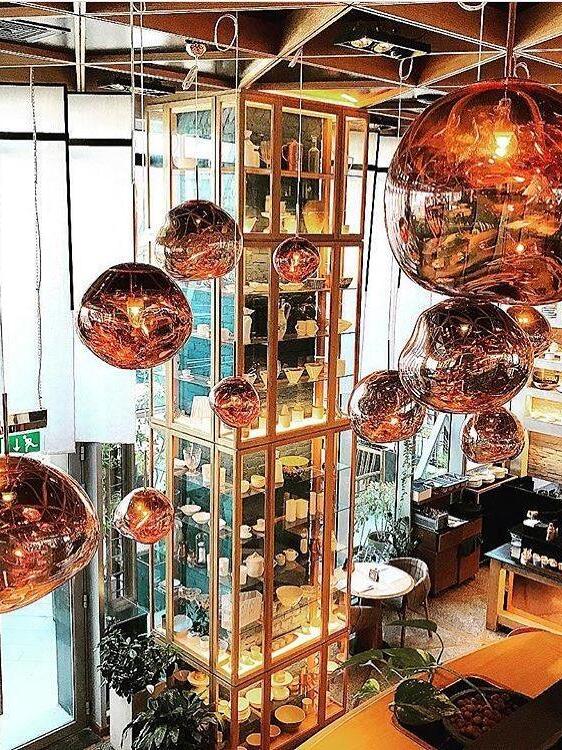 Red-orange shades beside interior shelving