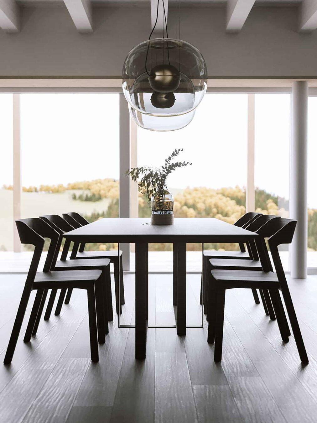Glass globe pendant above a table facing the garden