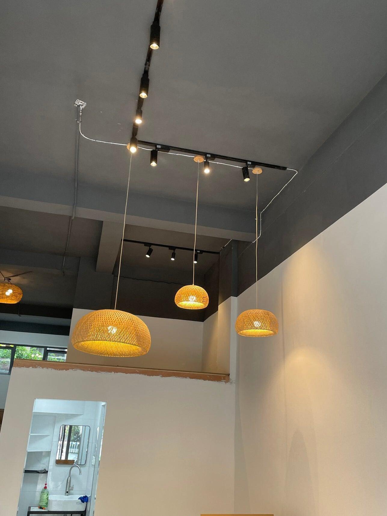 Separate woven pendants at different heights in a room